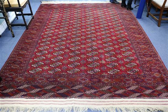 A Turkish red ground carpet 340 x 250cm